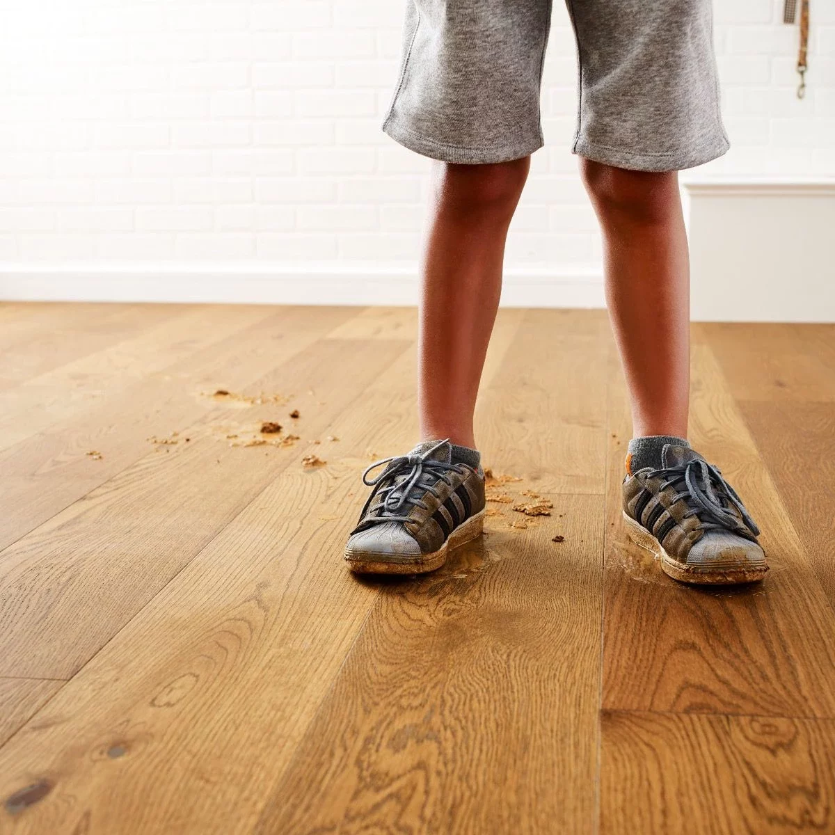 Exquisite-FH820-02040-WarmedOak-LaundryRoom Kid's dirty footprints on hardwood flooring | Best Buy Interior Finishes