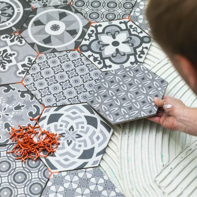 flooring-tile-installation-2 Worker installing tiles | Best Buy Interior Finishes